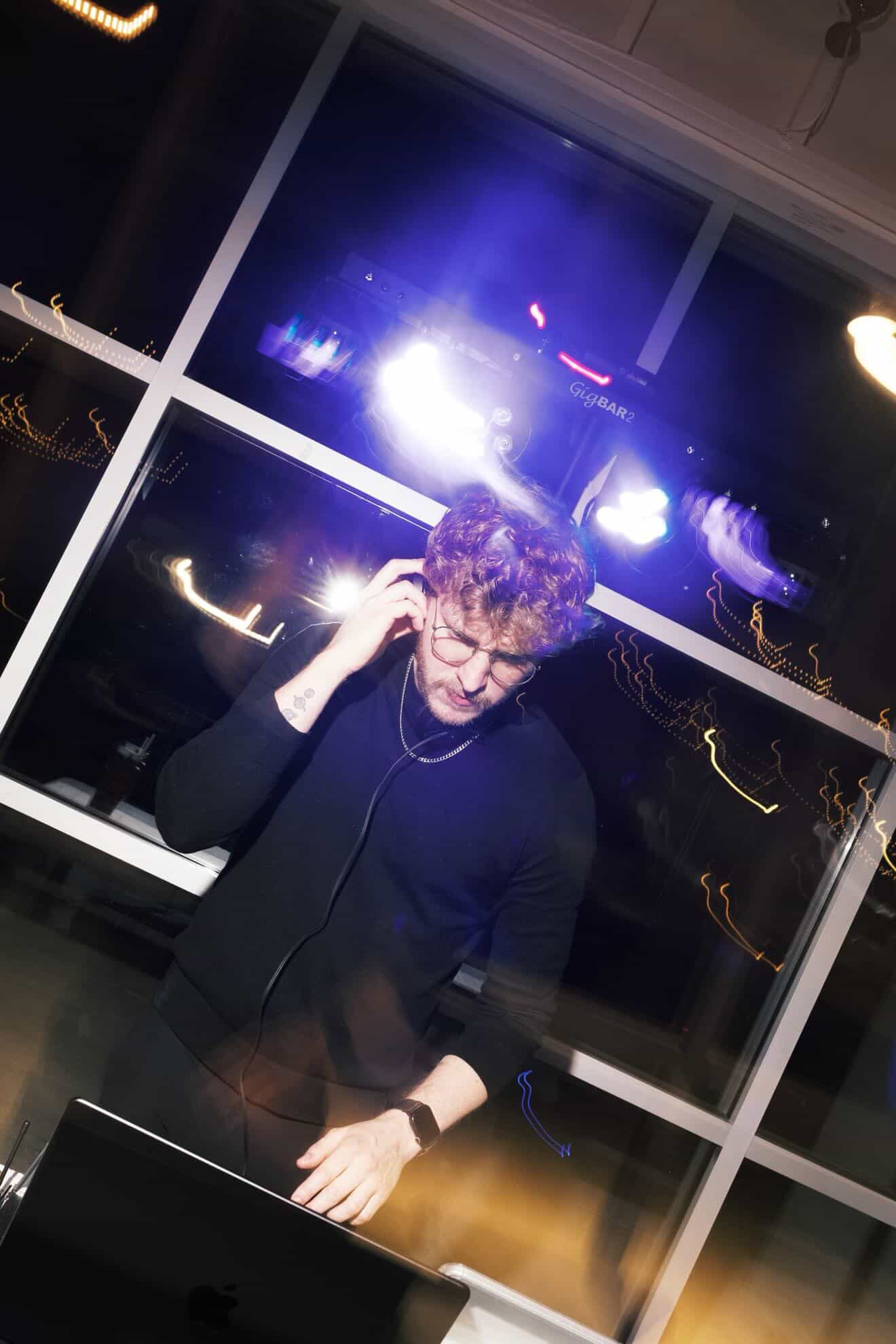 Matt mixing music at an event